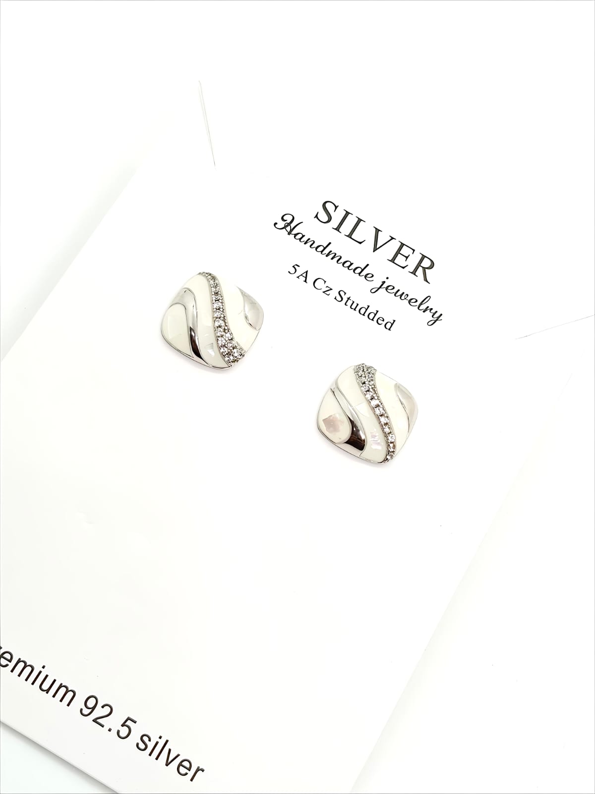 Silver-Tone Wave Stud Earrings with Crystal Accents by SilvSaga